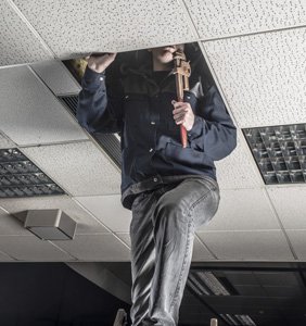 Man repairing a roof